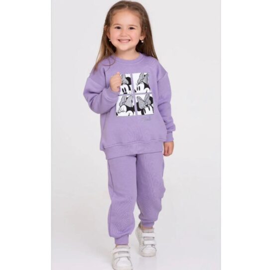 A little girl wearing a Mini Mouse Tracking suite hoodie and joggers.