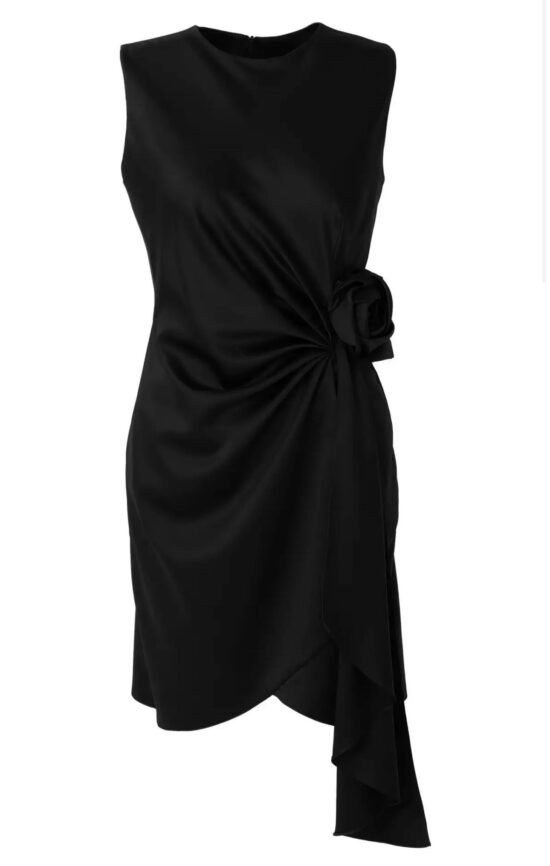 An asymmetric black dress with ruffles.